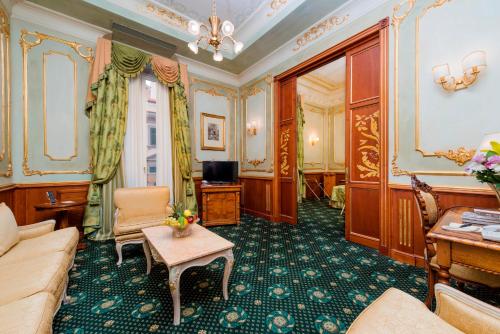 a living room with a couch and a table at Grand Hotel Wagner in Palermo