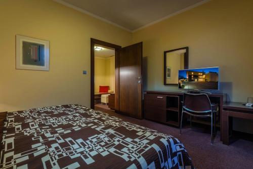 Ένα ή περισσότερα κρεβάτια σε δωμάτιο στο Hotel Villa Bianca