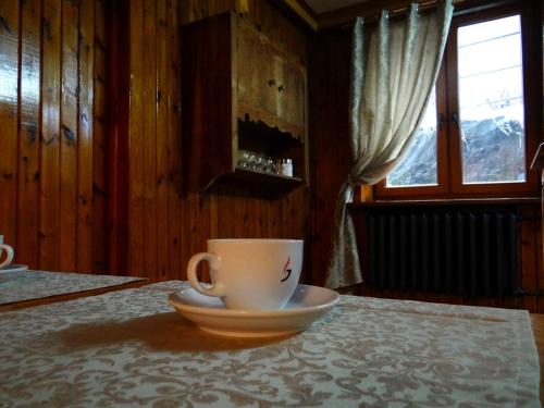a coffee cup and a saucer on a table at Schody Do Nieba in Zakopane