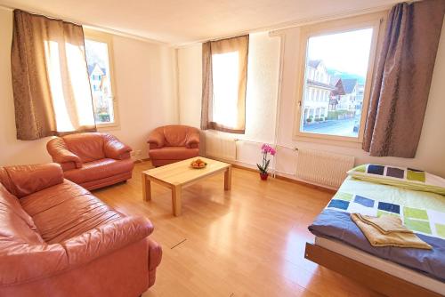 a living room with a couch and a table at New West Station 7 in Interlaken