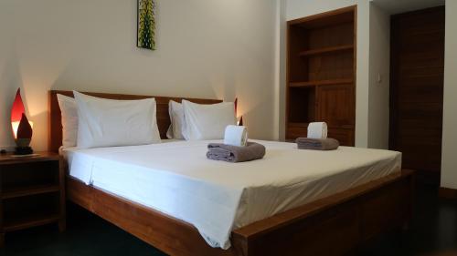 Postel nebo postele na pokoji v ubytování Dream Divers Resort