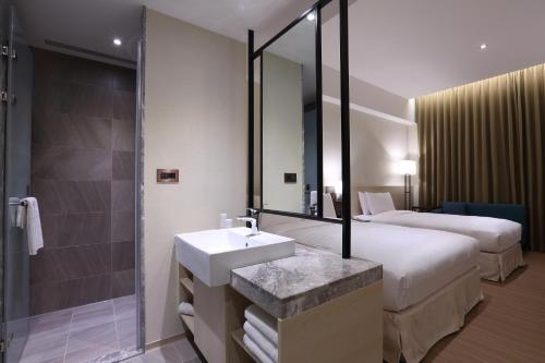 Postel nebo postele na pokoji v ubytování Full Kind Hotel