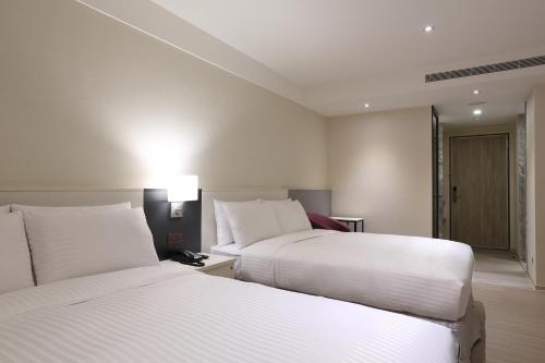 Postel nebo postele na pokoji v ubytování Full Kind Hotel