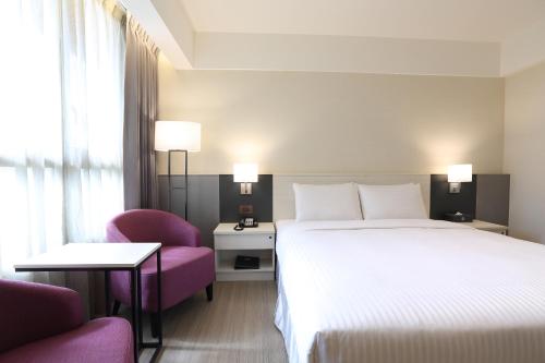 Postel nebo postele na pokoji v ubytování Full Kind Hotel