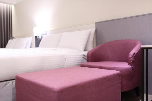 Postel nebo postele na pokoji v ubytování Full Kind Hotel