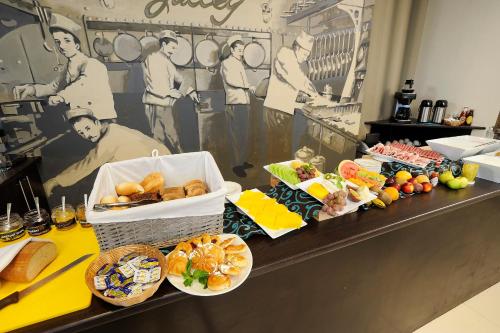 a buffet with many different types of food on a counter at Beach Hotel Swakopmund in Swakopmund