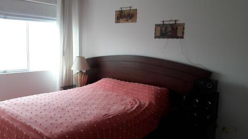מיטה או מיטות בחדר ב-Residencial Pershing