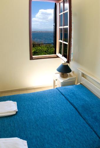 Ένα ή περισσότερα κρεβάτια σε δωμάτιο στο Alianthos Suites