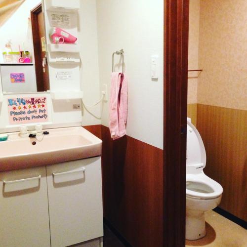 a bathroom with a toilet and a sink at Fukuoka Guesthouse Little Asia Kokura in Kitakyushu