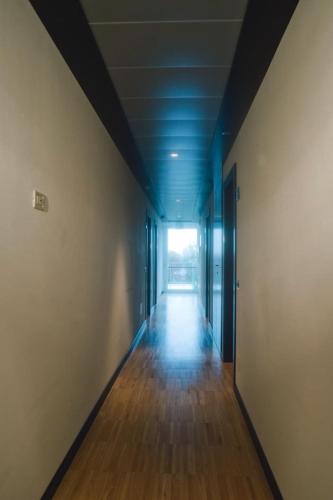 an empty hallway with blue ceilings and wood floors at San Marco in Montecchio Maggiore