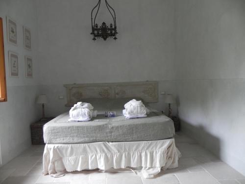 Una cama o camas en una habitación de Locanda di Terramare