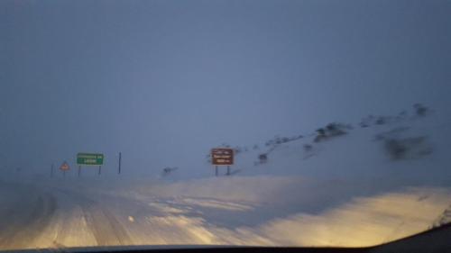 a view from a car of a highway with signs at Hotel Peña Pandos in Felechosa