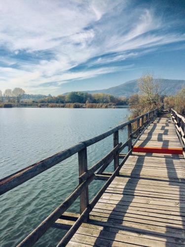 a wooden bridge over a large body of water at B & B Da Giusy in Corte Franca