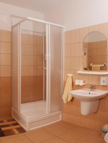 a bathroom with a shower and a sink at Lawa in Wrocław