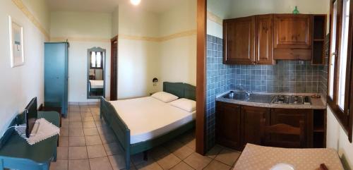 A bed or beds in a room at Residence Costamartino