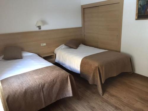 Postel nebo postele na pokoji v ubytování Apartaments Turistics Pirineu