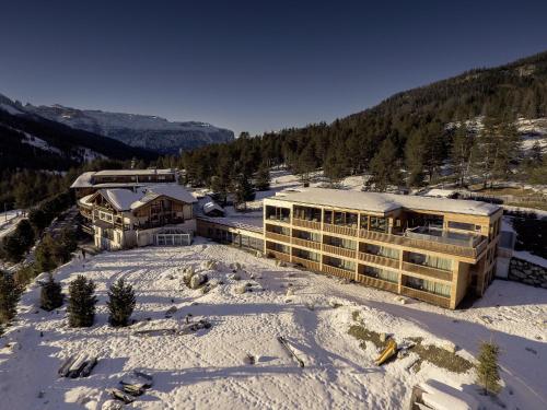 an aerial view of a hotel in the snow at Hotel Gran Paradiso in San Cassiano