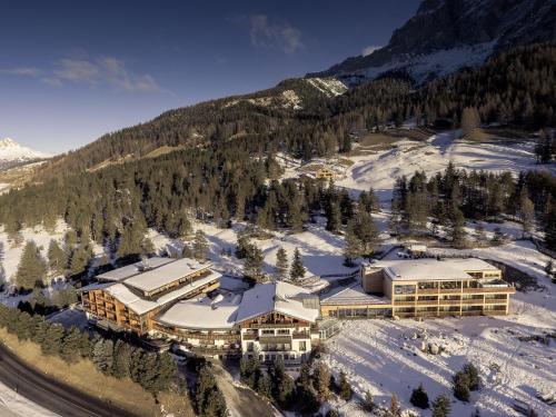 an aerial view of a resort in the snow at Hotel Gran Paradiso in San Cassiano