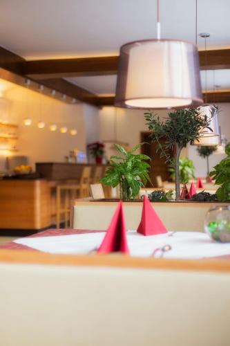 a table with red napkins on top of it at Belvedere in Semmering
