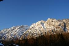 a snow covered mountain with a blue sky in the background at Pension Bergfried in Grödig