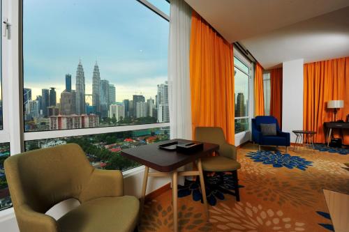a hotel room with a view of a city at Tamu Hotel & Suites Kuala Lumpur in Kuala Lumpur