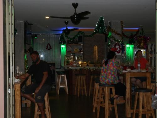 a group of people sitting at a bar at Living Chilled Koh Tao in Koh Tao