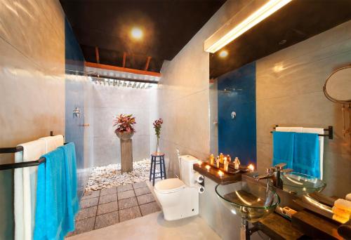 a bathroom with a sink and a toilet at Dickman Resort "The Boutique Hotel" in Negombo