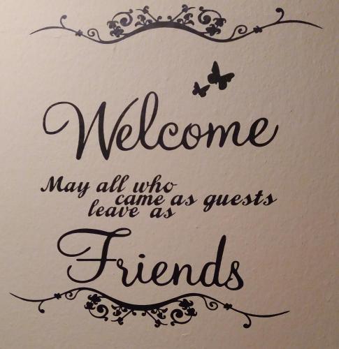 a sign that says welcome may all who came as guests leave as friends at Gästehaus Auszeit in Unterlamm