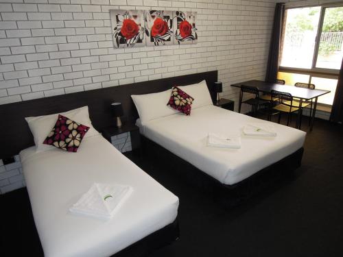 Cama o camas de una habitación en Jackaroo Apartments