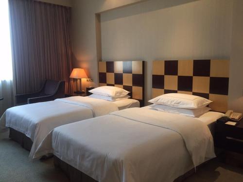 Postel nebo postele na pokoji v ubytování Hiyet Oriental Hotel