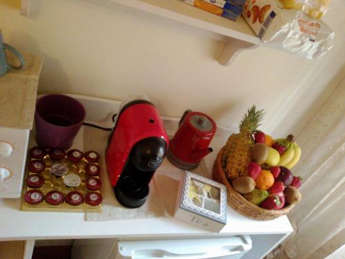 a shelf with a bunch of fruit on it at Casa Gioia in Taranto