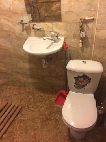 a bathroom with a toilet and a sink at DILIJAN Apartment in Dilijan