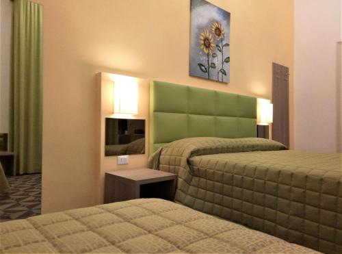 Krevet ili kreveti u jedinici u okviru objekta Moonlight Hotel&Suites