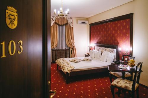 Un pat sau paturi într-o cameră la Casa Salzburg