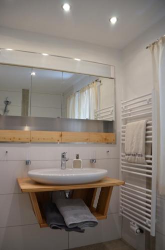a bathroom with a sink and a mirror at Ferienhaus Ferch in Turracher Hohe