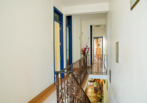 a hallway with a staircase in a house at Indravilla in Flic-en-Flac