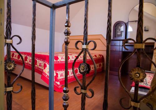 a bedroom with a bed with a red blanket at Indravilla in Flic-en-Flac