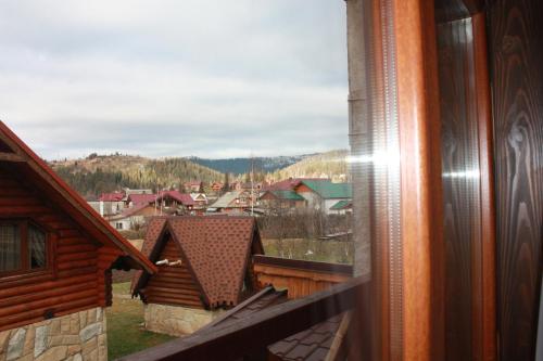 a view of a town from a window of a house at Apple House in Mykulychyn