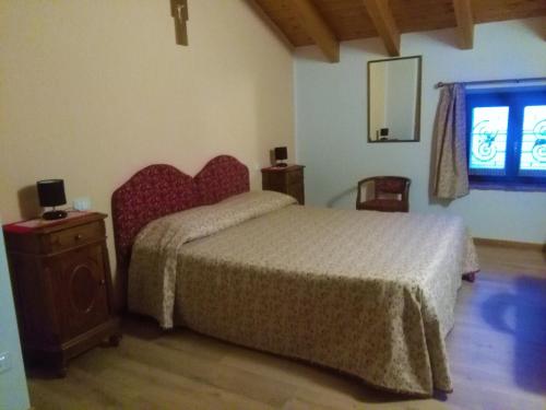 Posteľ alebo postele v izbe v ubytovaní B&B Paradiso