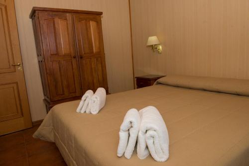 Una cama o camas en una habitación de Cabañas de Nené Aparts
