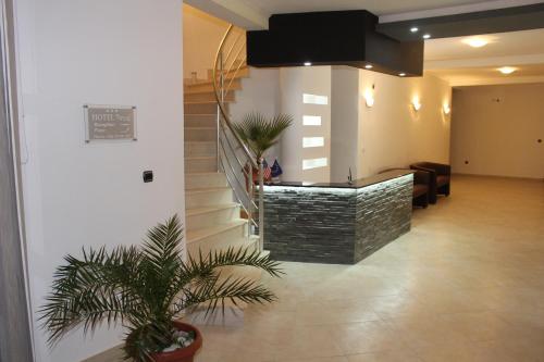 a lobby with a staircase in a building at Apartments Perezaj II in Ulcinj