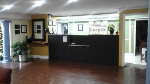 a lobby with a front desk in a building at Knights Inn - Lithonia in Lithonia