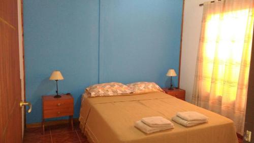 Ένα ή περισσότερα κρεβάτια σε δωμάτιο στο Las Casitas de Emilia