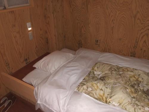 Katil atau katil-katil dalam bilik di Guesthouse Otaru Wanokaze