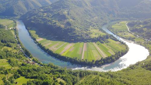 an aerial view of a river and a valley at Kucerak na Drini in Bajina Bašta