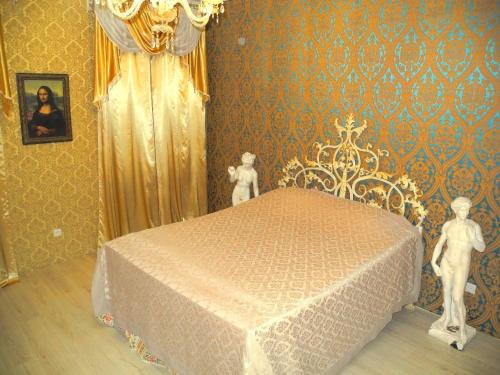 Łóżko lub łóżka w pokoju w obiekcie Goldstar