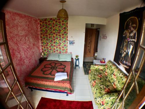 Ein Bett oder Betten in einem Zimmer der Unterkunft Pousada Tia Cleide