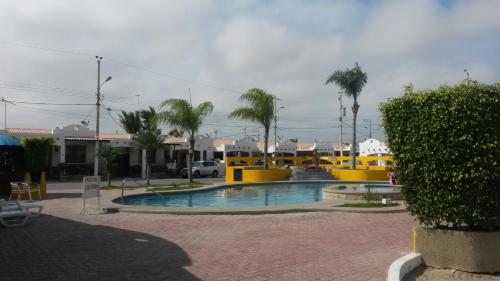 a small pool in a parking lot with palm trees at NUESTRA CASA-OUR HOME Salinas by A2CC in Salinas
