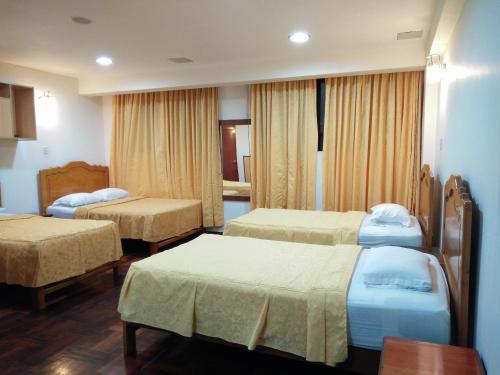 Кровать или кровати в номере Hotel Panamericano