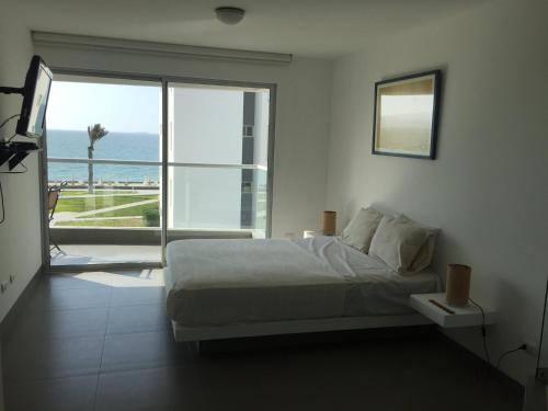 Tempat tidur dalam kamar di Paracas Apartment